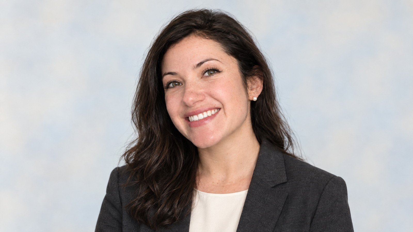 AI-generated editorial portrait of Alissa Mahler in a dark blazer against a pale background.