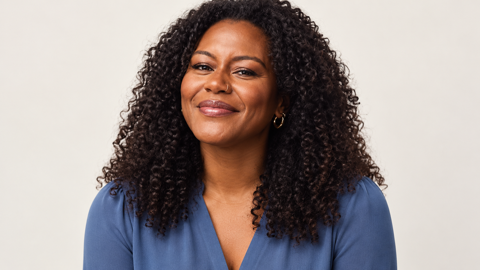 AI-generated editorial portrait of Janai Norman in a blue blouse against a light background.